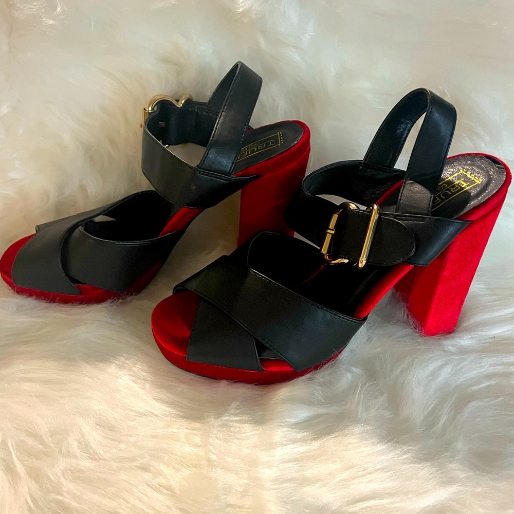 Truffle collection black leather strap with red velvet heels.